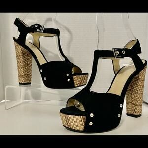 Gianni Ferrante black suede T-strap with straw woven heel and platform .